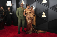 John Gaines, from left, Victoria Monét, and Hazel Monét Gaines arrive at the 66th annual Grammy Awards on Sunday, Feb. 4, 2024, in Los Angeles.