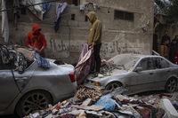 Palestinians survey the destruction from an Israeli airstrike in Rafah, Gaza, on Friday, Feb. 9.