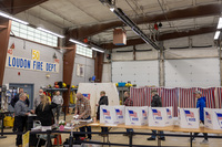 Voters wait to cast their ballots on Jan. 23 in Loudon, N.H. Shortly before voting began, some voters in the state got calls from a faked version of President Biden's voice urging them not to vote, a sign of the potential that deepfakes could have on the electoral process.